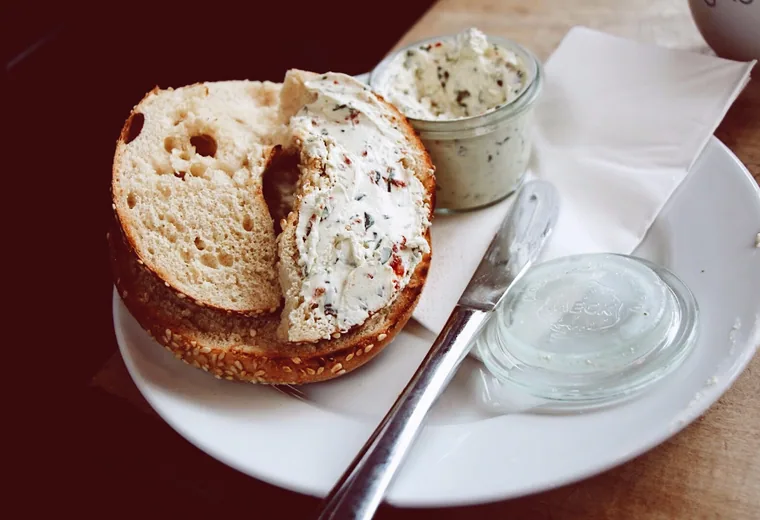 A bagel with cream cheese