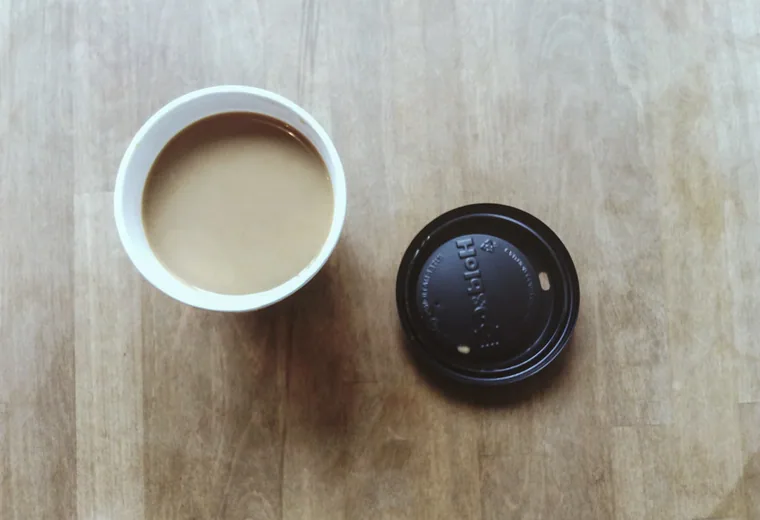 A coffee cup with a to-go lid