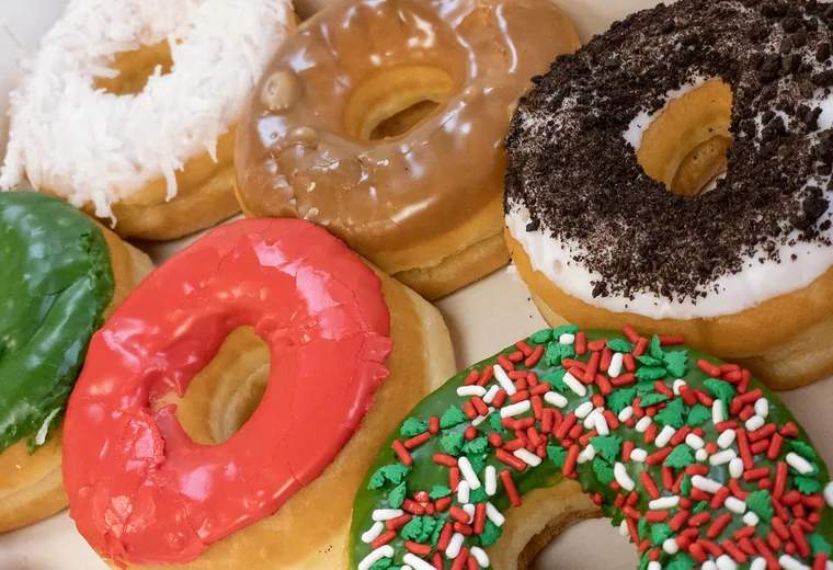 Assorted frosted donuts on a tray